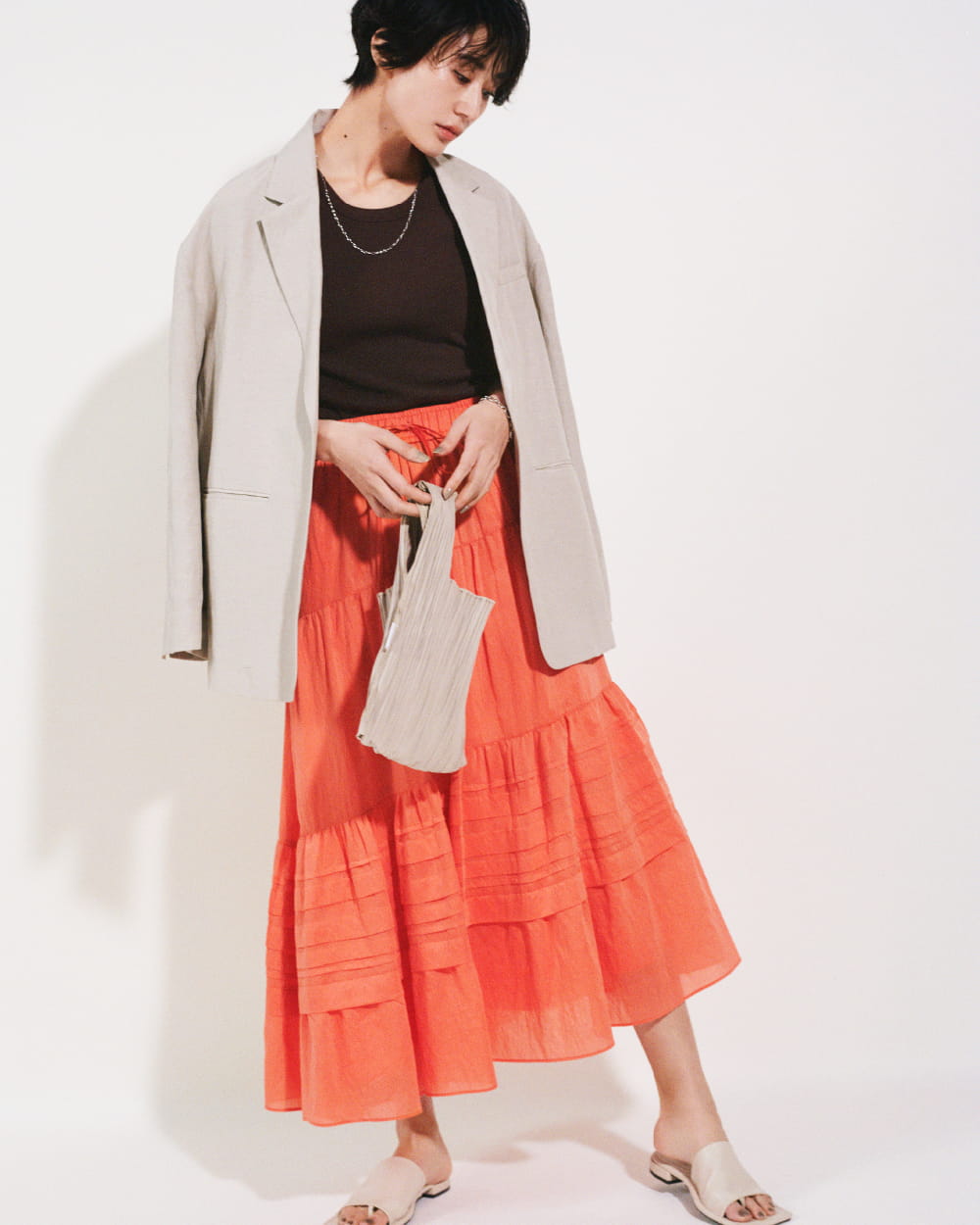 Jacket 15,400yen (tax in), Tops 4,180yen (tax in), Skirt 9,900yen (tax in), Necklace 4,620yen (tax in), Bracelet 4,400yen (tax in), Eco bag 3,190yen (tax in), and Sandals 10,120yen (tax in)