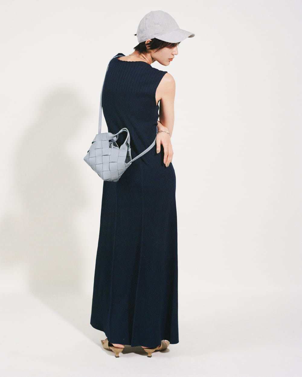 Knit dress 9,460yen (tax in), Cap 5,500yen (tax in), Necklace 4,620yen (tax in), Bracelet 4,400yen (tax in), Bag 9,460yen (tax in), and Sandals 10,780yen (tax in)